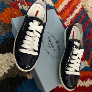 PRADA Sport Patent Leather Sneakers in Navy Blue.